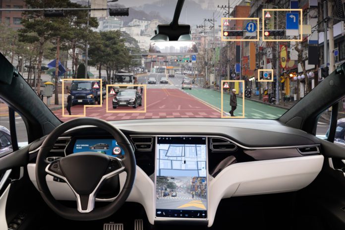 The interior of an autonomous driverless vehicle. Courtesy Adobe.